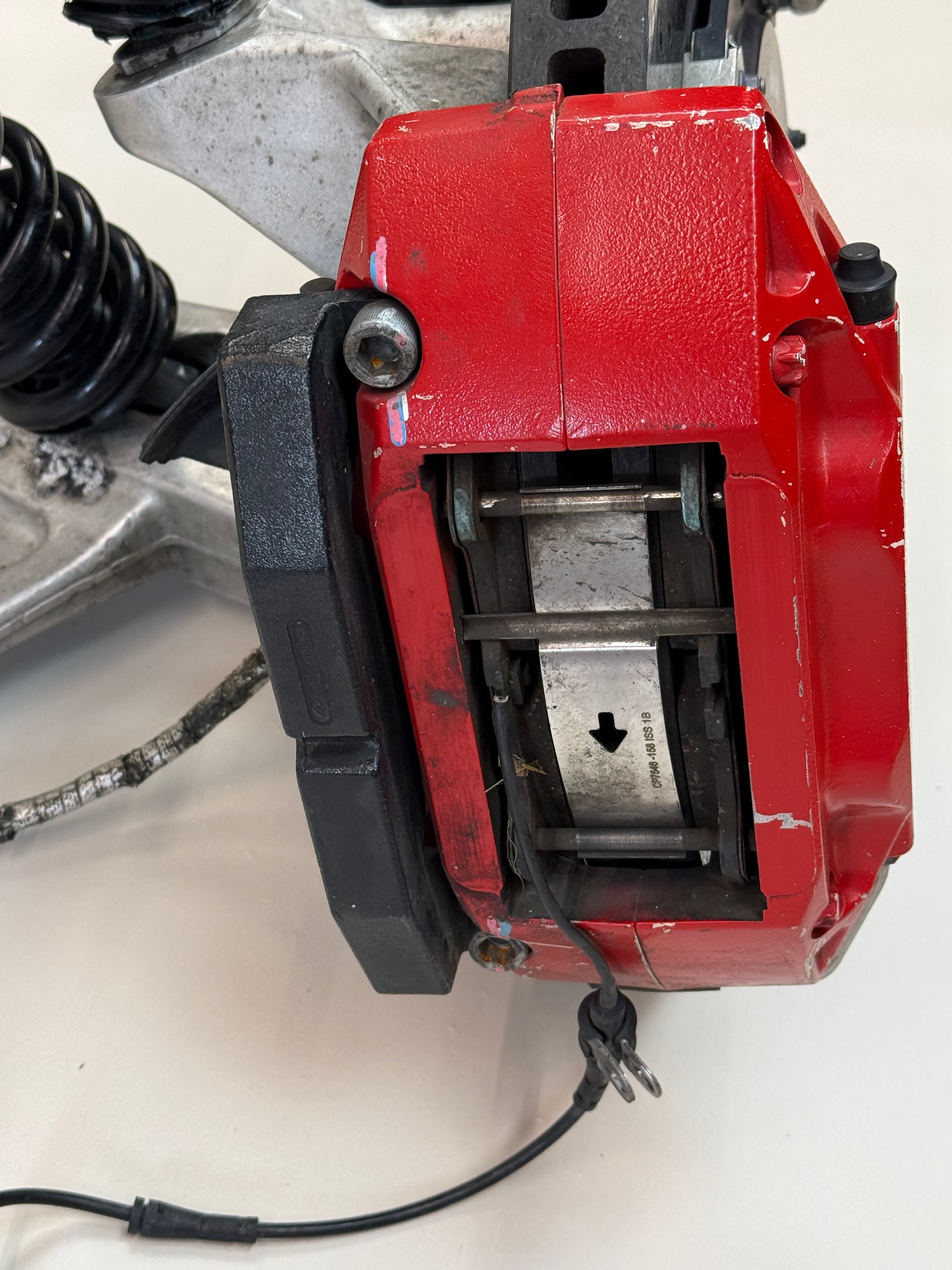McLaren 570S Rear Left Suspension & Brake Assembly OEM | Carbon Ceramic Rotor Red Caliper Shock