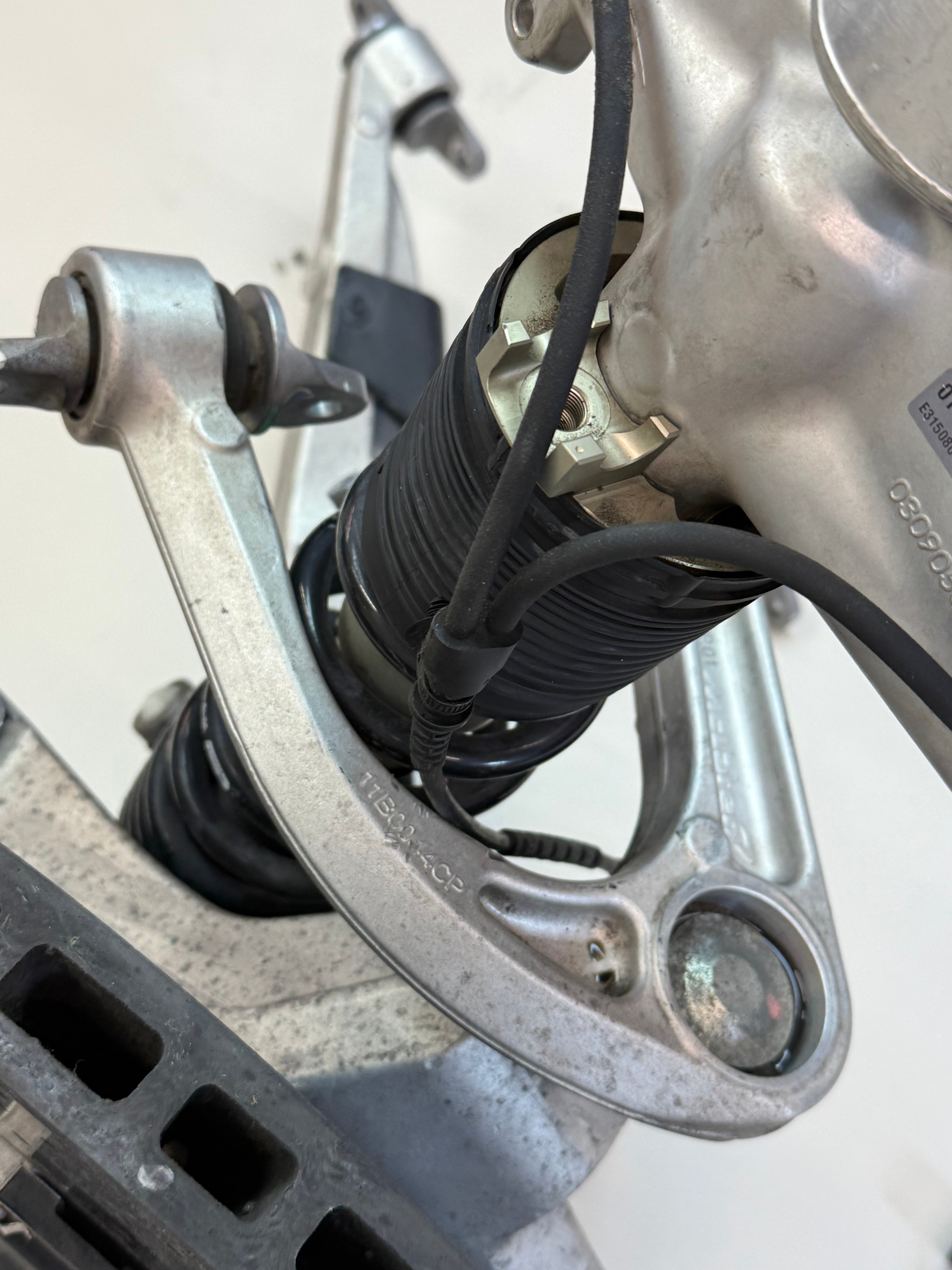 McLaren 570S Front Left Side Suspension & Brake Assembly OEM | Carbon Ceramic Rotor Red Caliper Shock